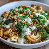 A nourishing vegan Roasted Brassica Bowl with crisp-tender veggies and creamy tahini-lemon dressing, ready to serve.