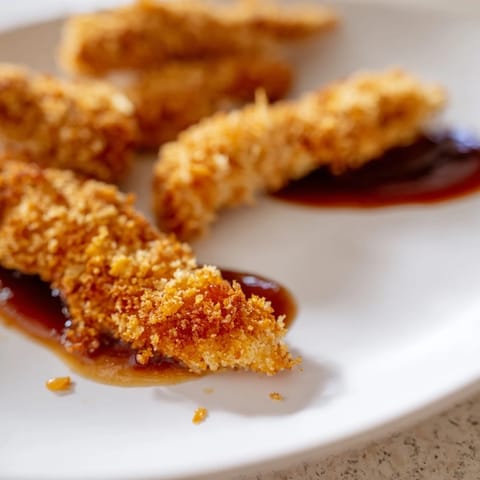 Golden, crispy Chicken Tenders fried to perfection and served with barbecue and honey-mustard dipping sauces.
